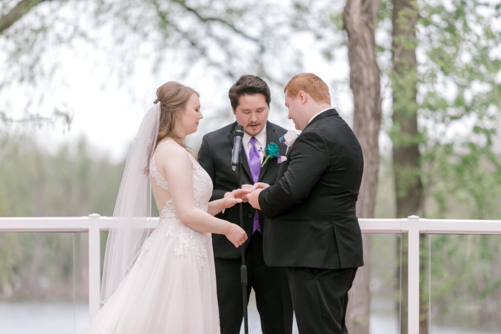 A man and woman holding hands while standing next to each other.