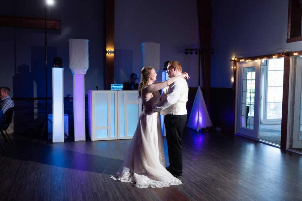 A man and woman dancing on the dance floor.