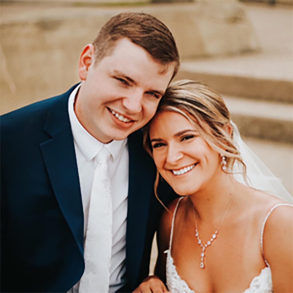 Wedding couple is sharing frame with a big smile