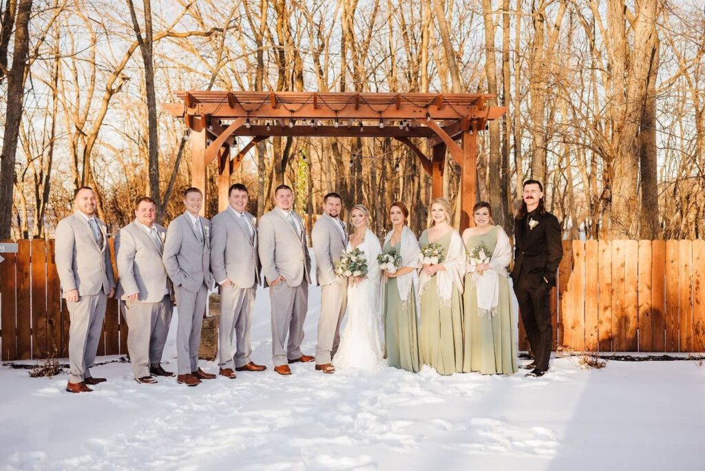 A group of people standing in the snow.