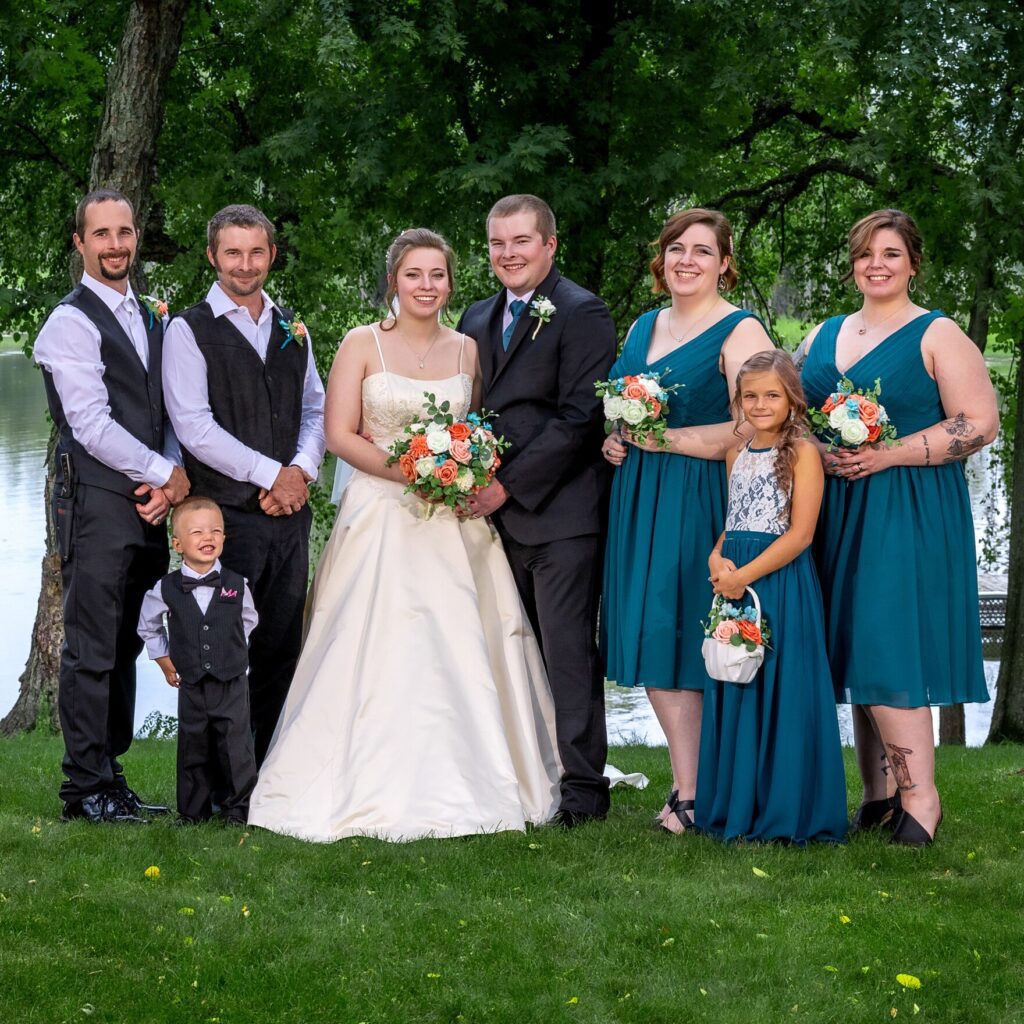 group photo of bride and groom with bridesmaids and best men