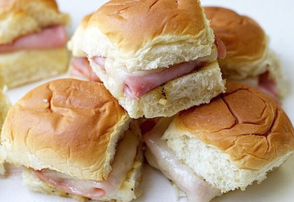 A pile of sandwiches sitting on top of each other.