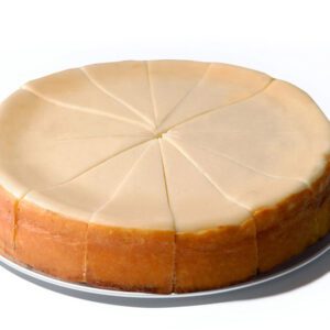 A cheesecake sitting on top of a white plate.