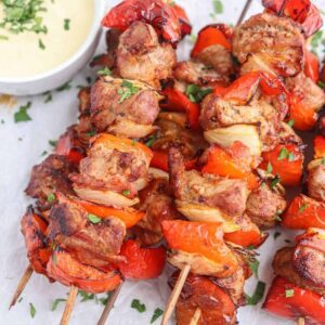 pork belly skewer with red peppers and onions