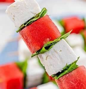 A watermelon and feta skewer is stacked on top of each other.