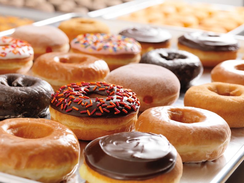 A bunch of different kinds of donuts on a table