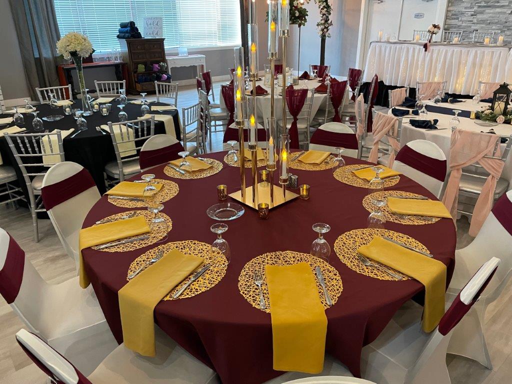 A table set up with red and yellow napkins.